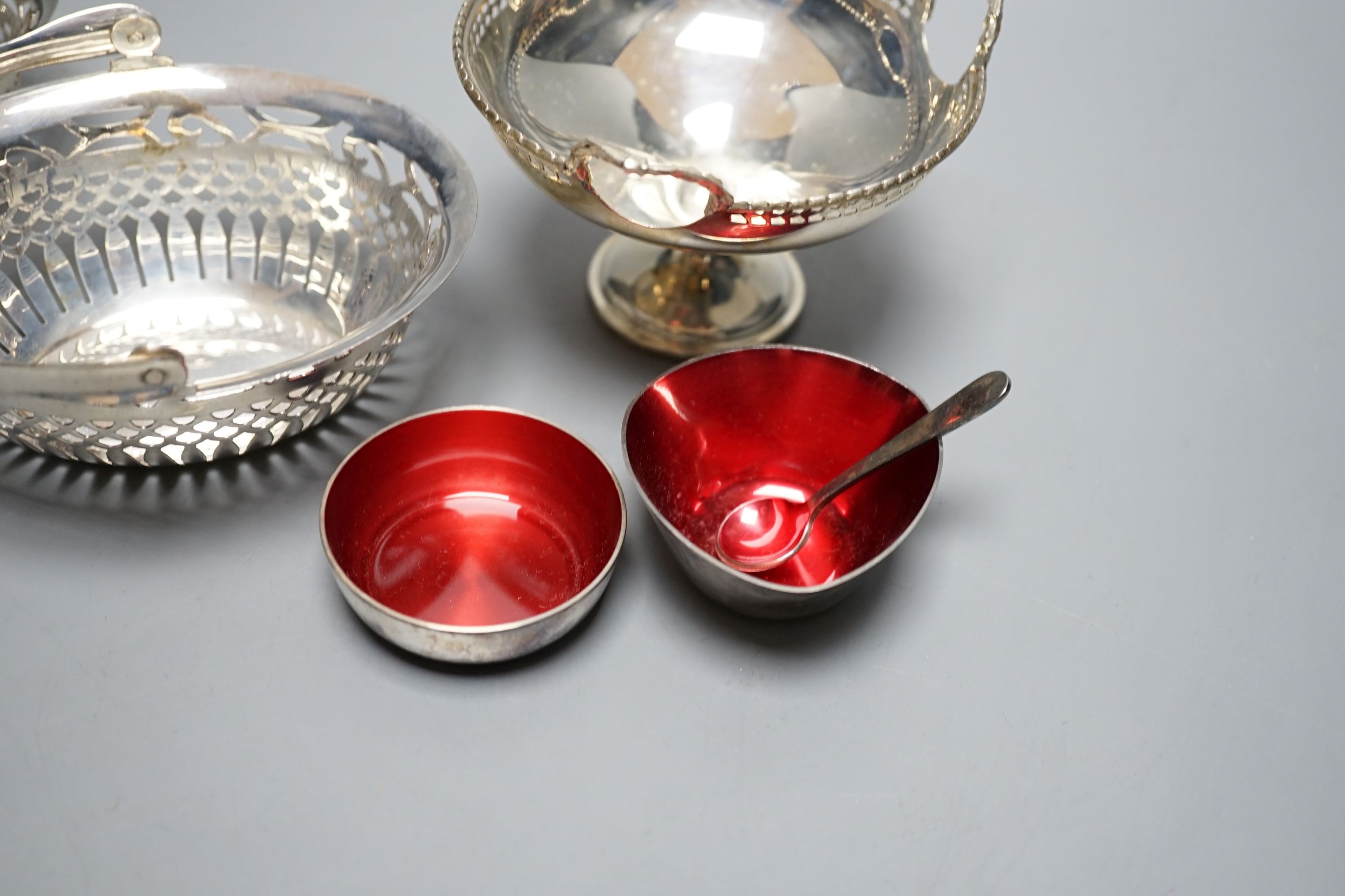 A pair of George V pierced silver bonbon baskets, a small pedestal bowl and napkin ring and two small Danish enamelled bowls.